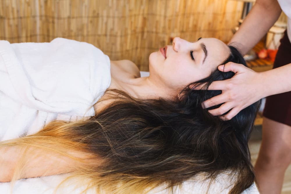 Close-up of a relaxing herbal scalp treatment for hair health.