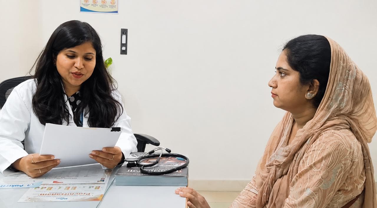 Doctor reviewing a patient's reports during a skin and hair consultation.