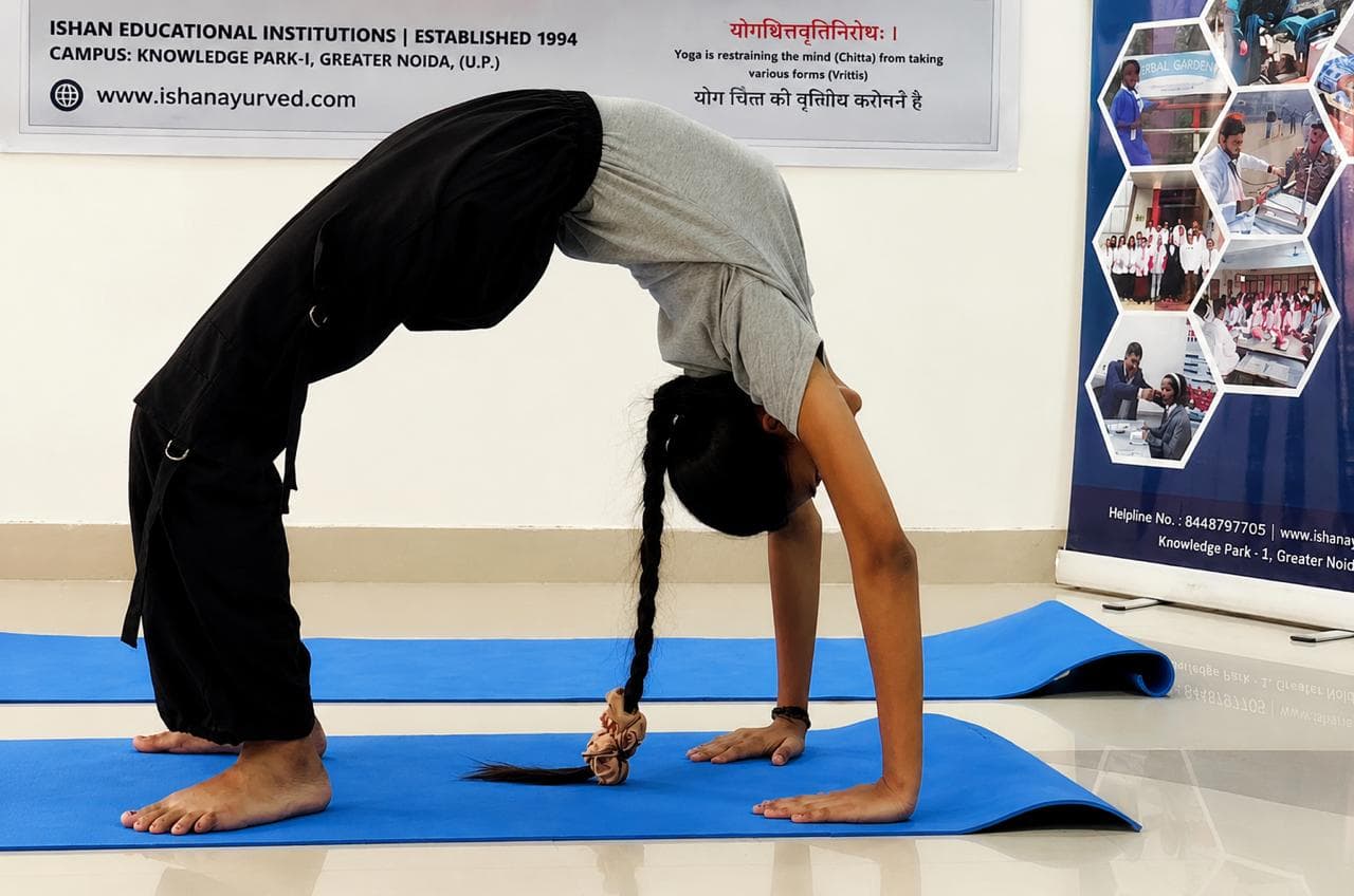 Guided Yoga Asana session at Ishan Ayurvedic Hospital.